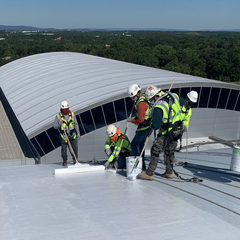 Roofing contractors installing Parapro 123 PMMA Flashing