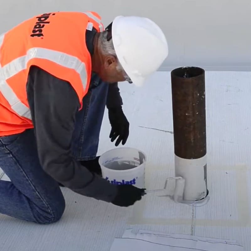 Contractor installing PMMA liquid flashing materials