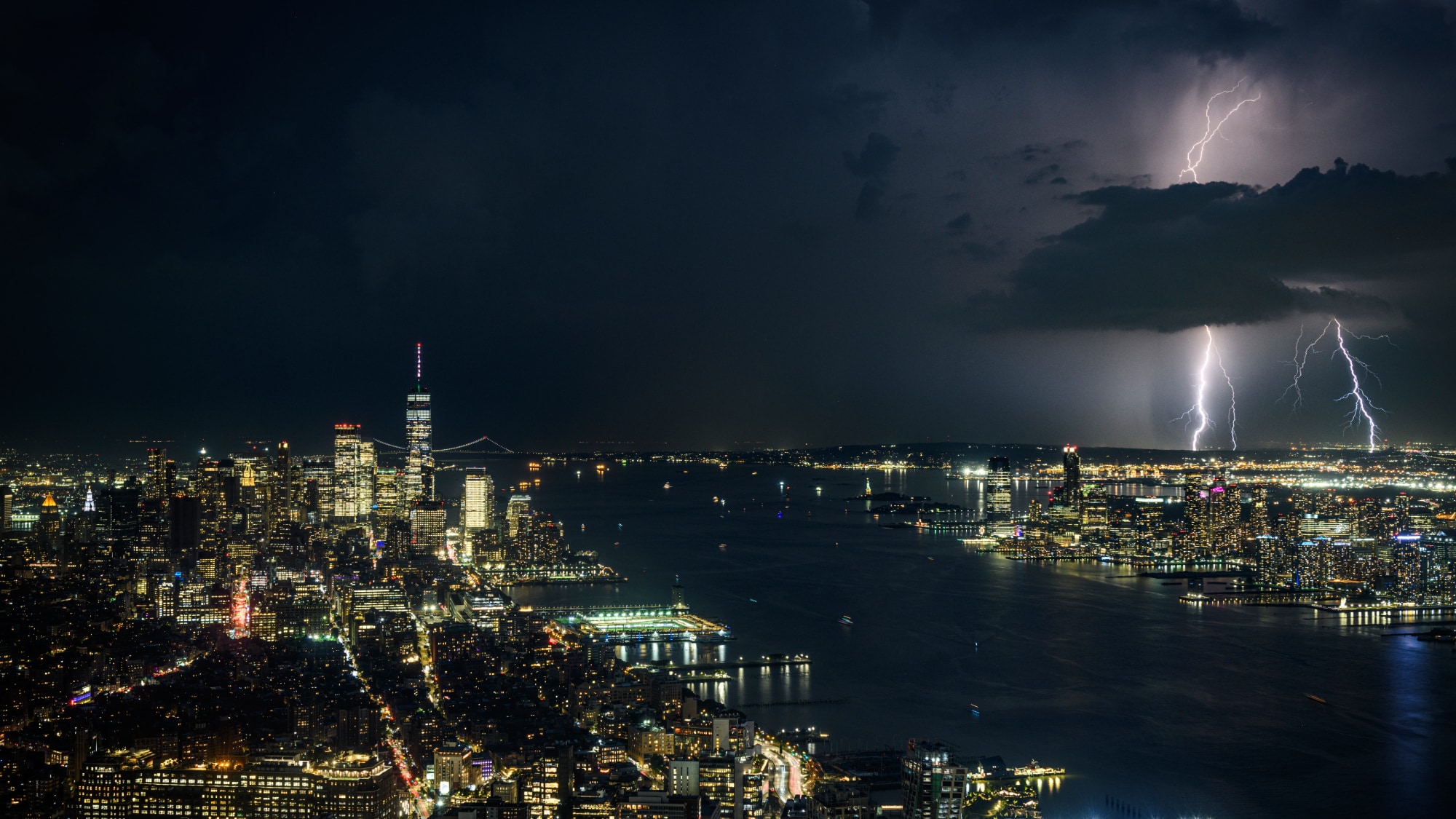 Aerial view of storm clouds rolling in over city skyline