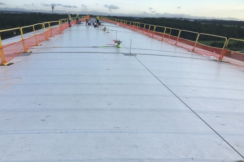 Contractors installing SBS Pro Base Sheets from Siplast