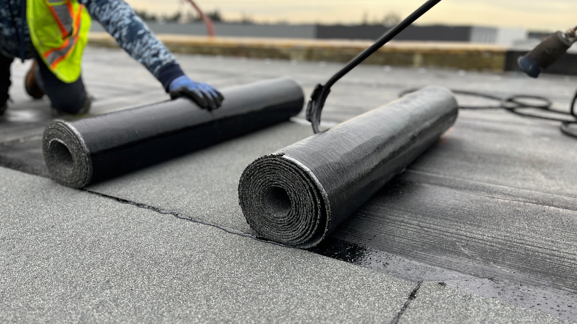 Commercial roofing contractor rolling out sbs roofing materials