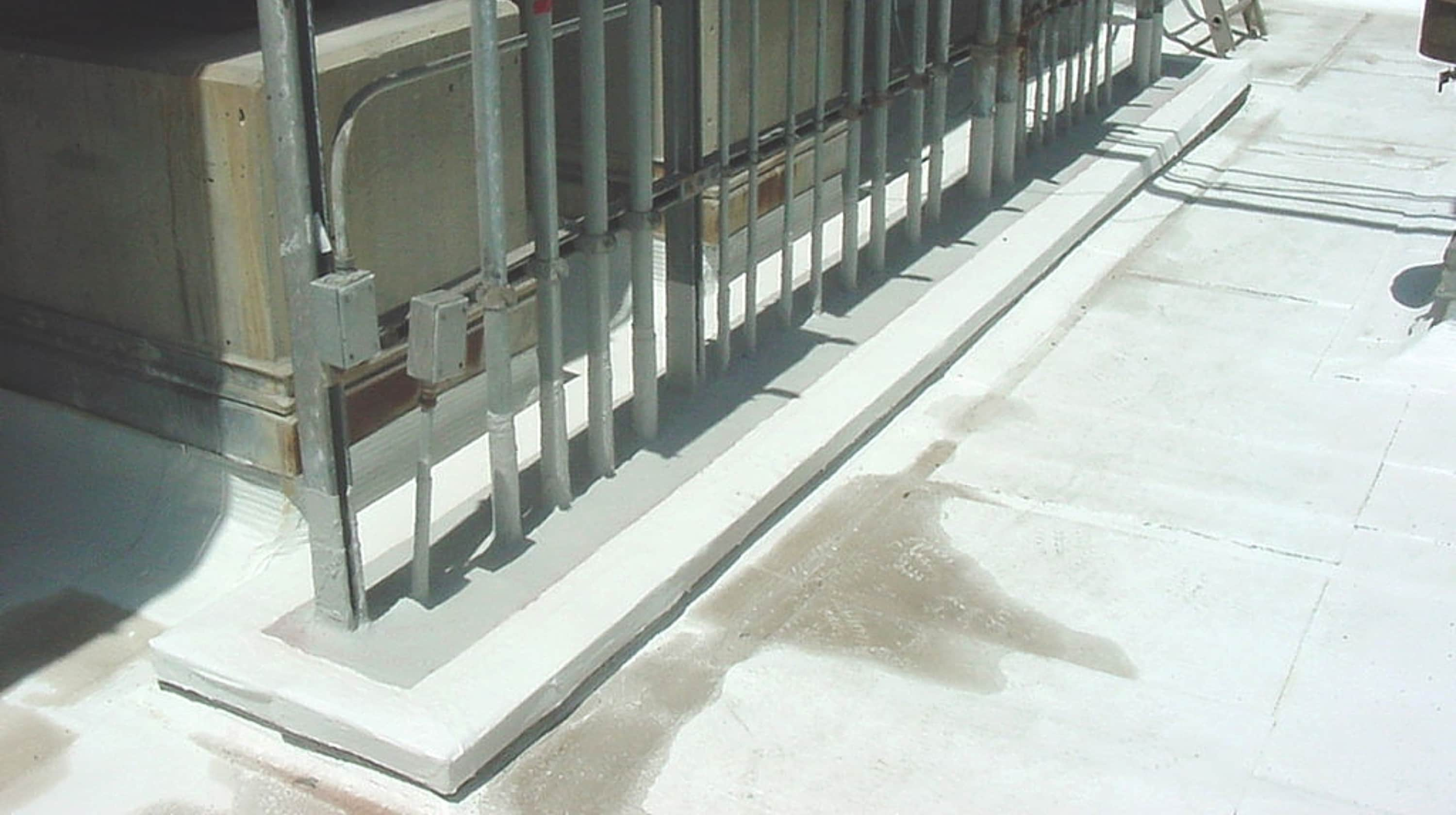 PMMA liquid-applied flashing used on curb details